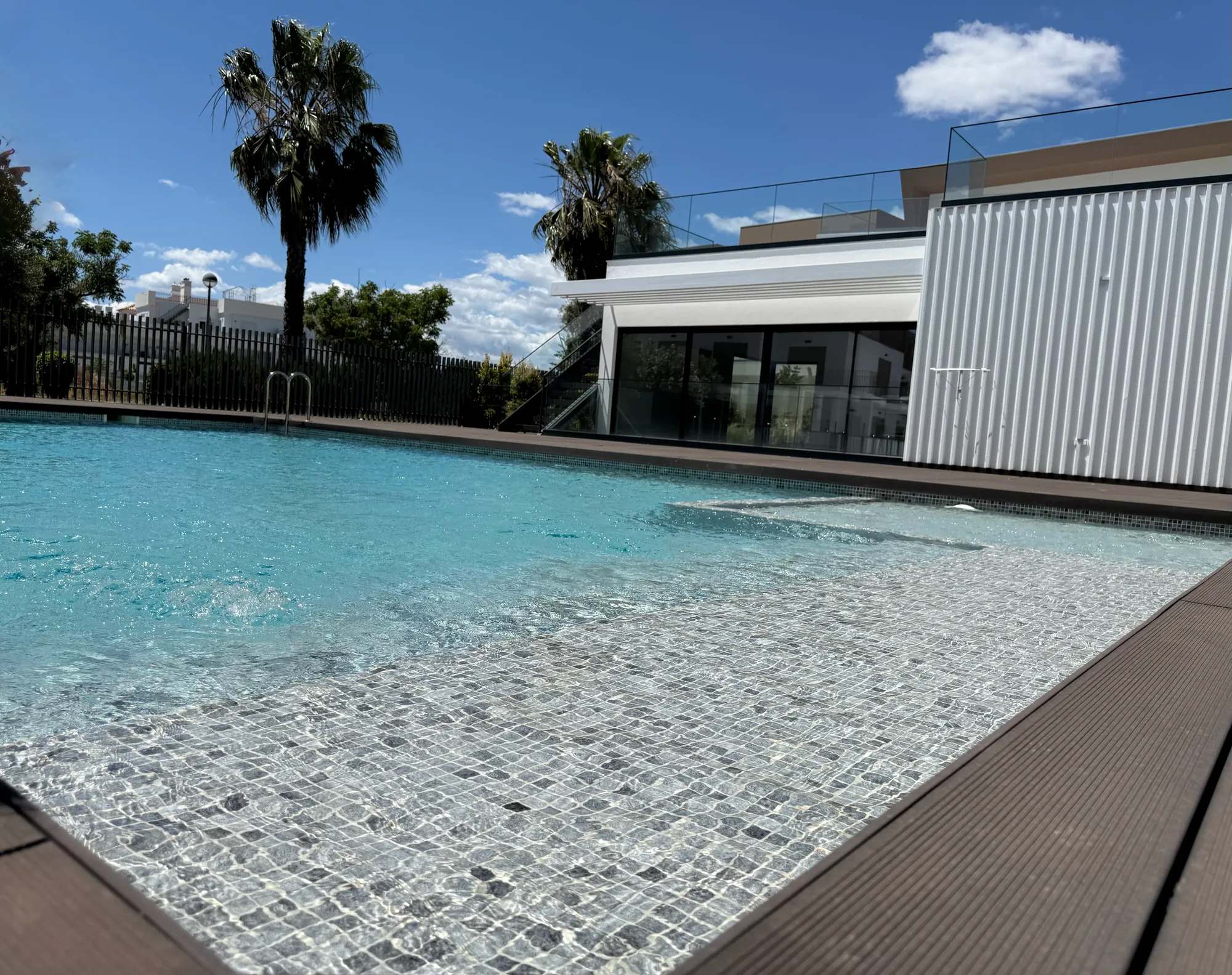 Shared pool and exterior building view