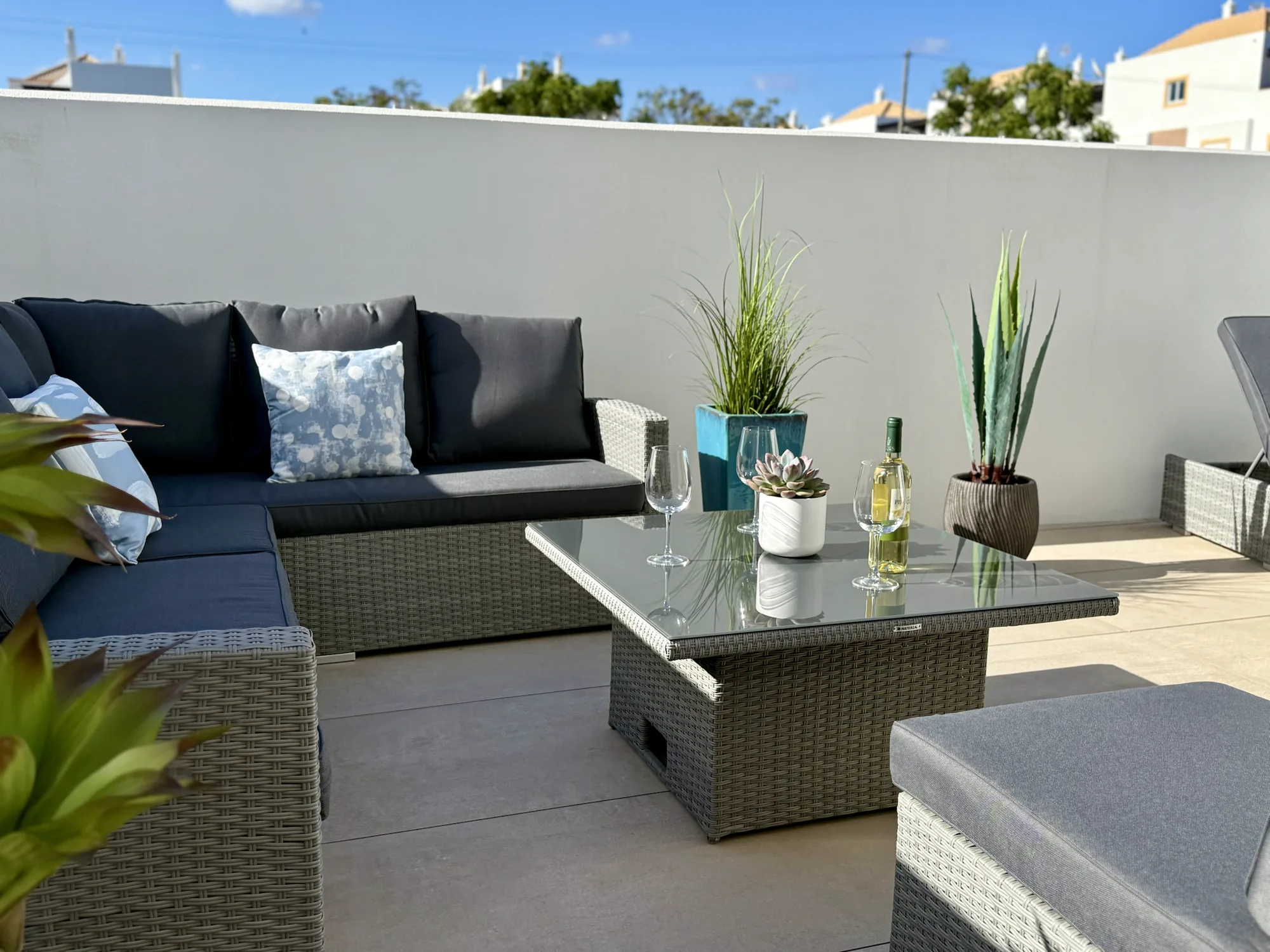 Terrace sun loungers under blue sky